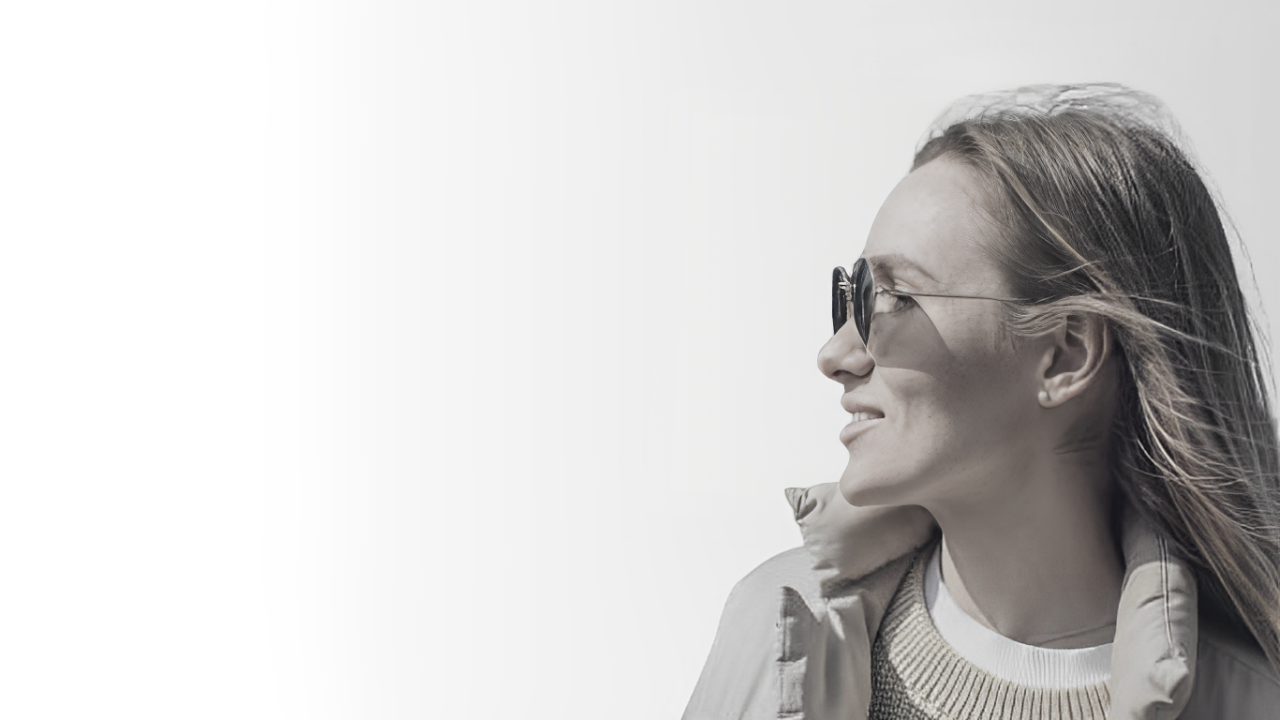 Woman with glasses on Youthify Aesthetics website